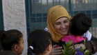 Palestinian teacher Hanan al-Hroub, who is shortlisted to win the Global Teacher Prize, is hugged by a student in the West Bank city of Ramallah February 17, 2016. Picture taken February 17.  REUTERS/Mohamad Torokman